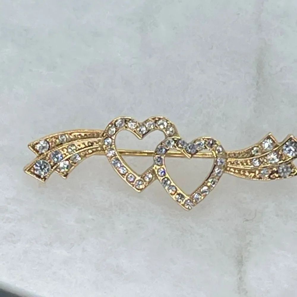 Vintage 1928 double heart ribbon rhinestone brooch.